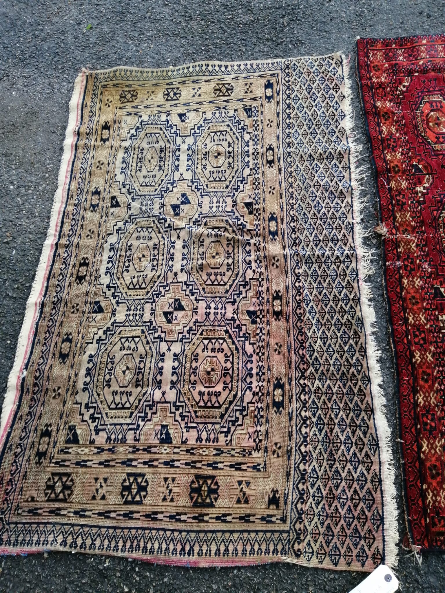 Three antique Salor mats, largest 140 x 82cm